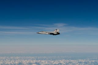 Handout image released by the Swedish Airforce shows a Russian MIG-31 fighter jet flying above the Baltic sea after violating Estonian air space